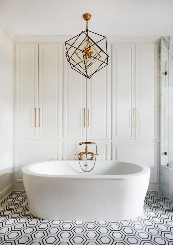Modern and sophisticated lighting fixtures complementing the overall style of a luxurious bathroom.