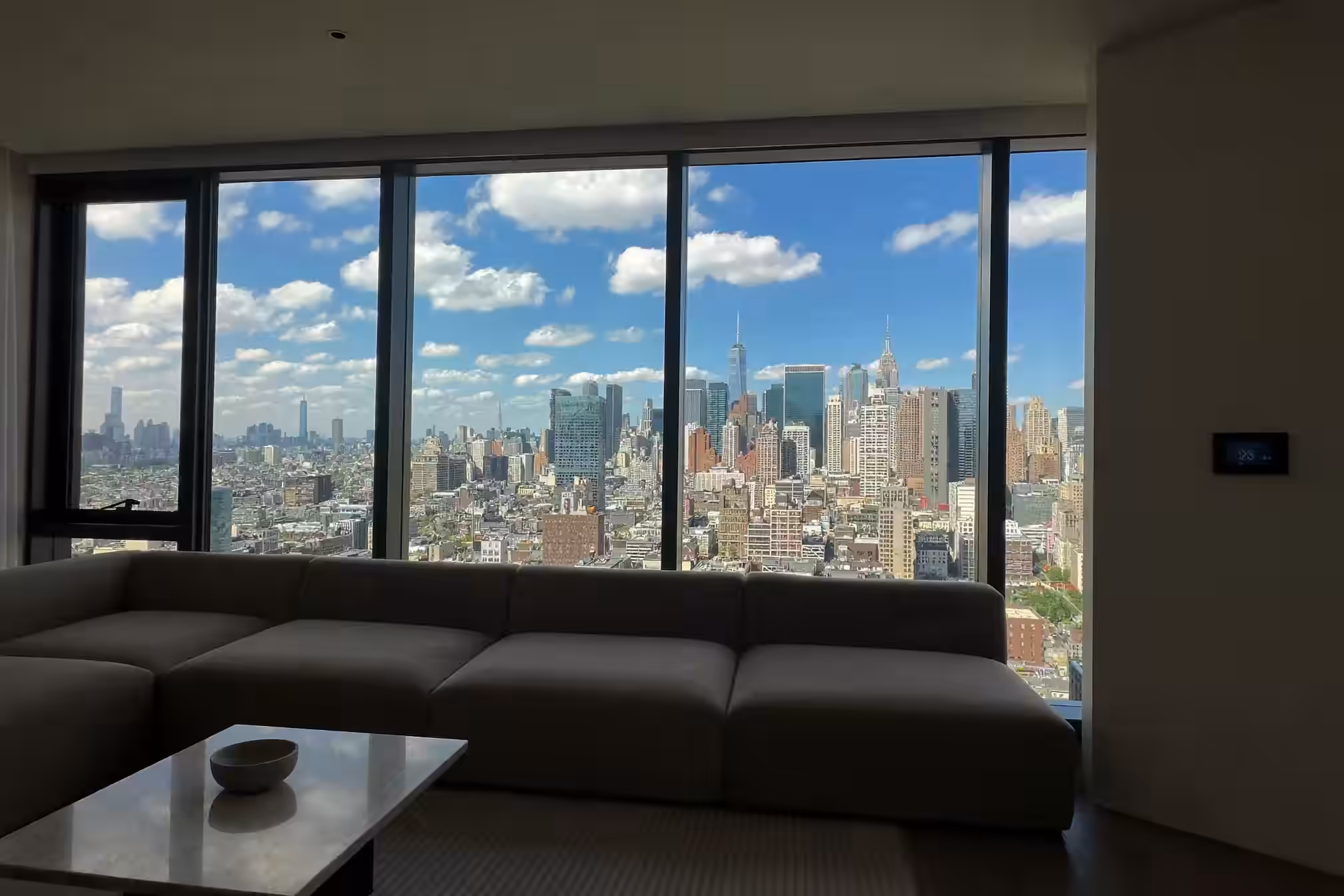 manhattan apartment summer skyline view smart home climate control energy savings